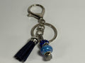 Geluks sleutelhanger met hoefnagel - blauw met tassel